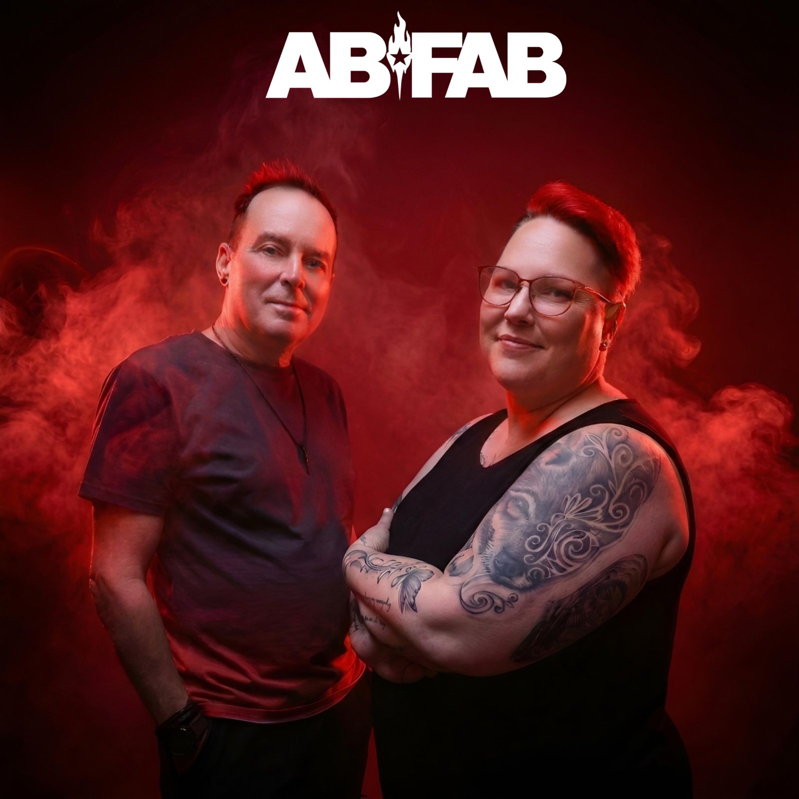 ABFAB logo above the two performers, with red smoke background, who will be part of the entertainment